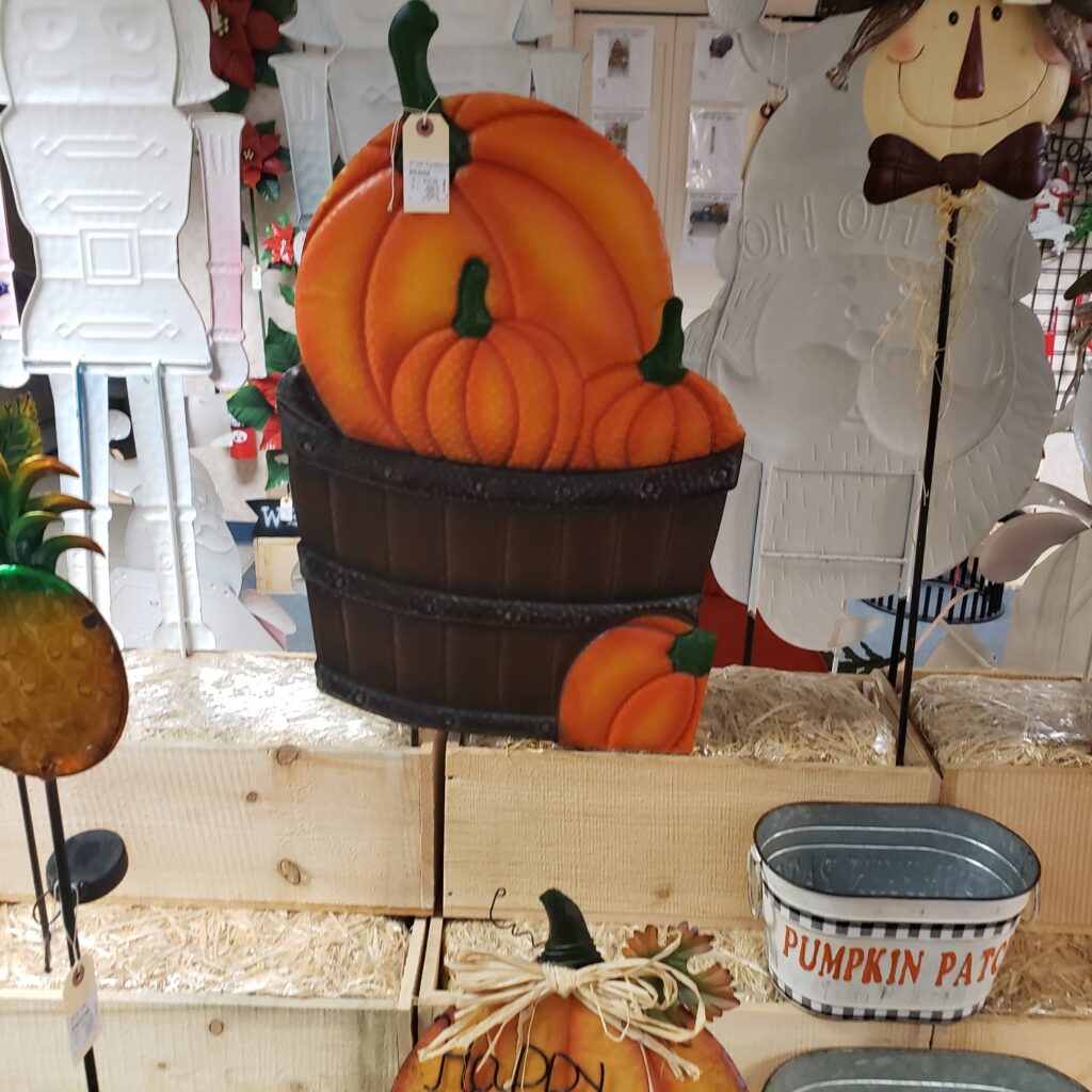 Metal Pumpkins In Barrel